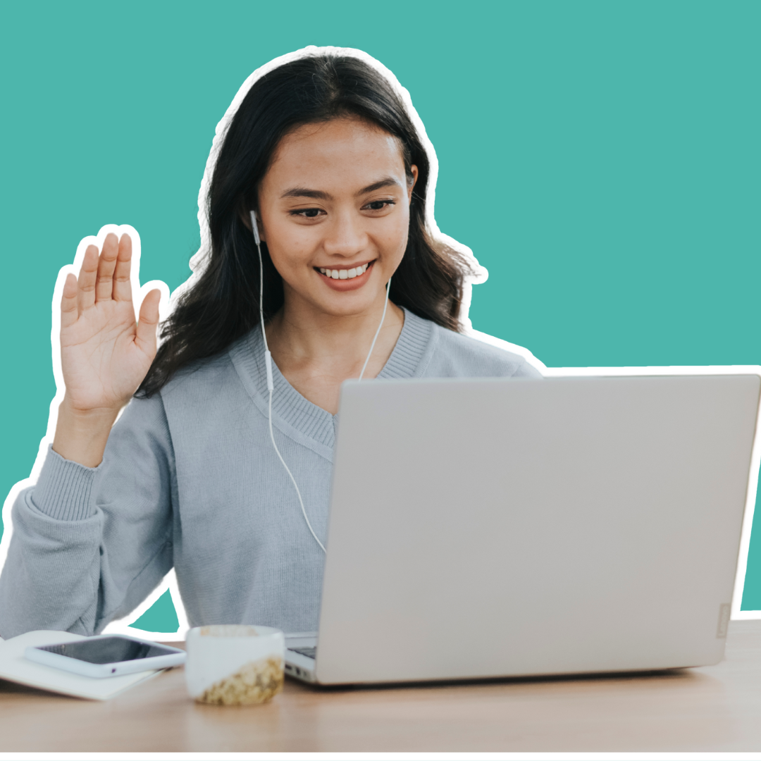Woman in a casual shirt smiling and waving at her laptop while seated, with a teal background.