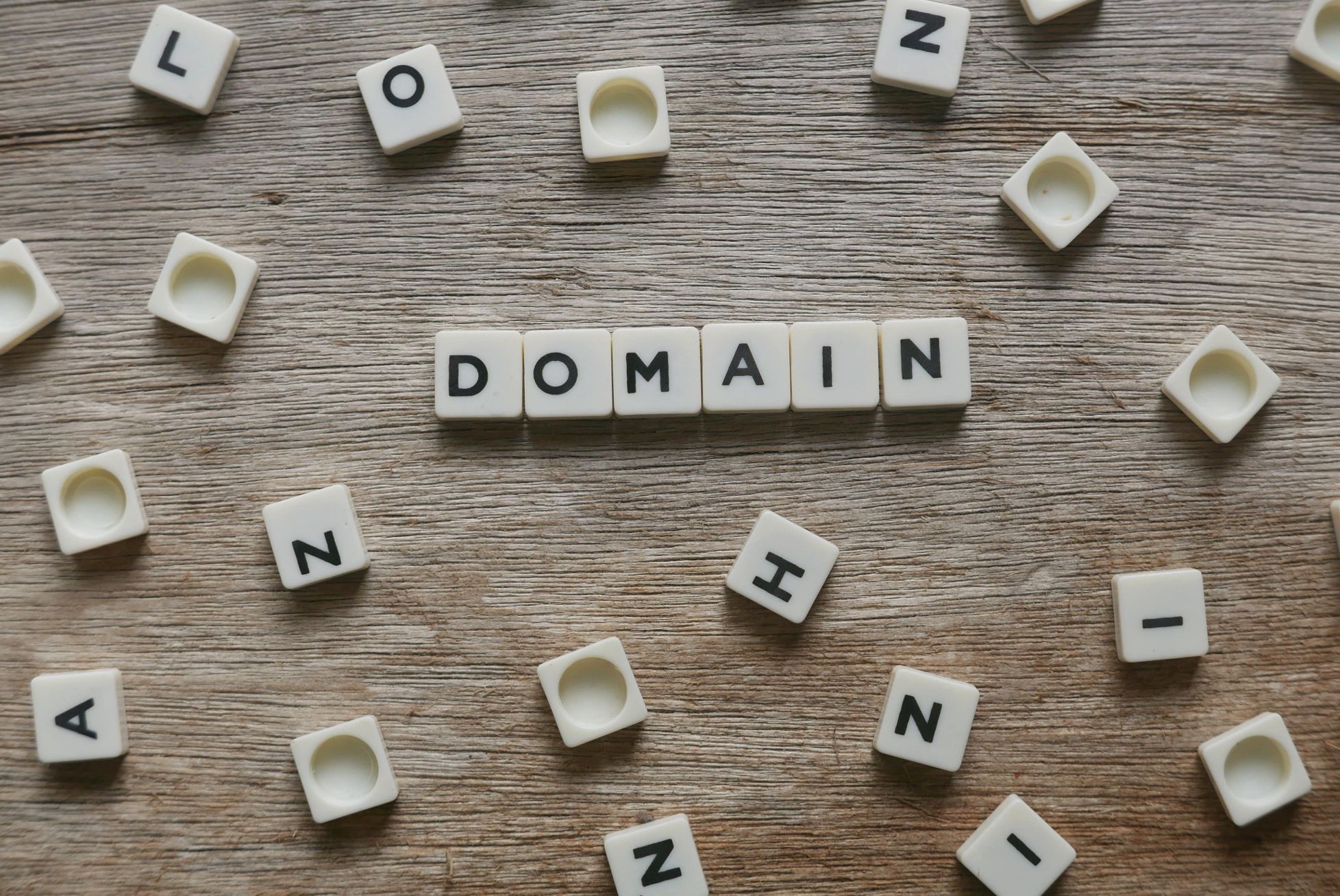 Domain word made of square letter word on wooden b 2022 11 01 00 05 25 utc min