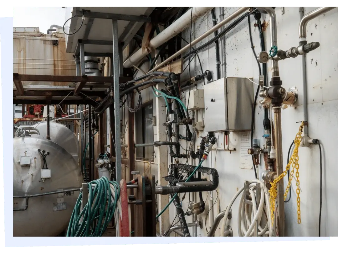 Industrial plumbing system with pipes and valves in facility