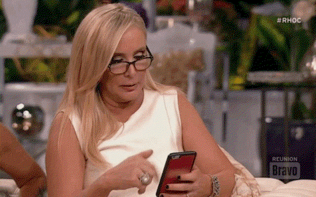 Woman scrolling on mobile phone.